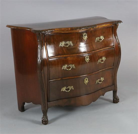 A late 19th century French flame mahogany bombe commode, W.3ft 4in. D.1ft 10in. H.2ft 10in.